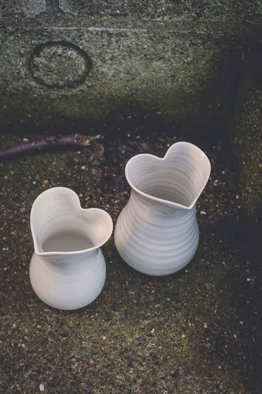 Large and medium heart vases in white
